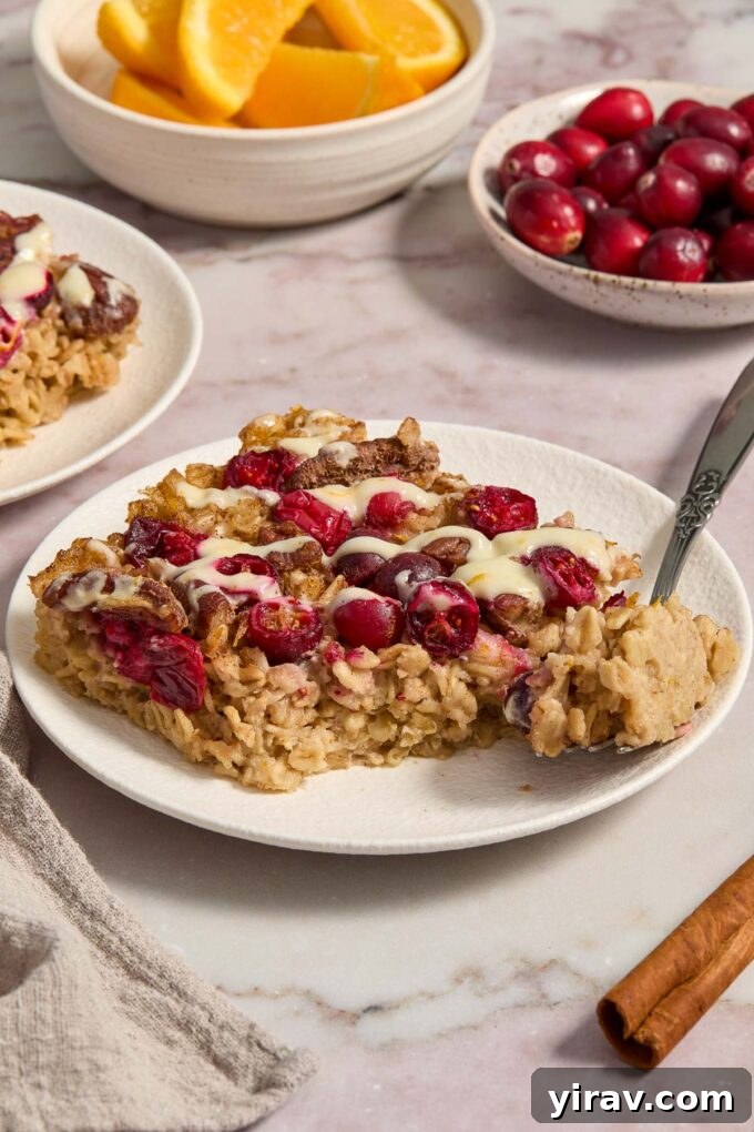 Baked oatmeal with cranberries on a plate.
