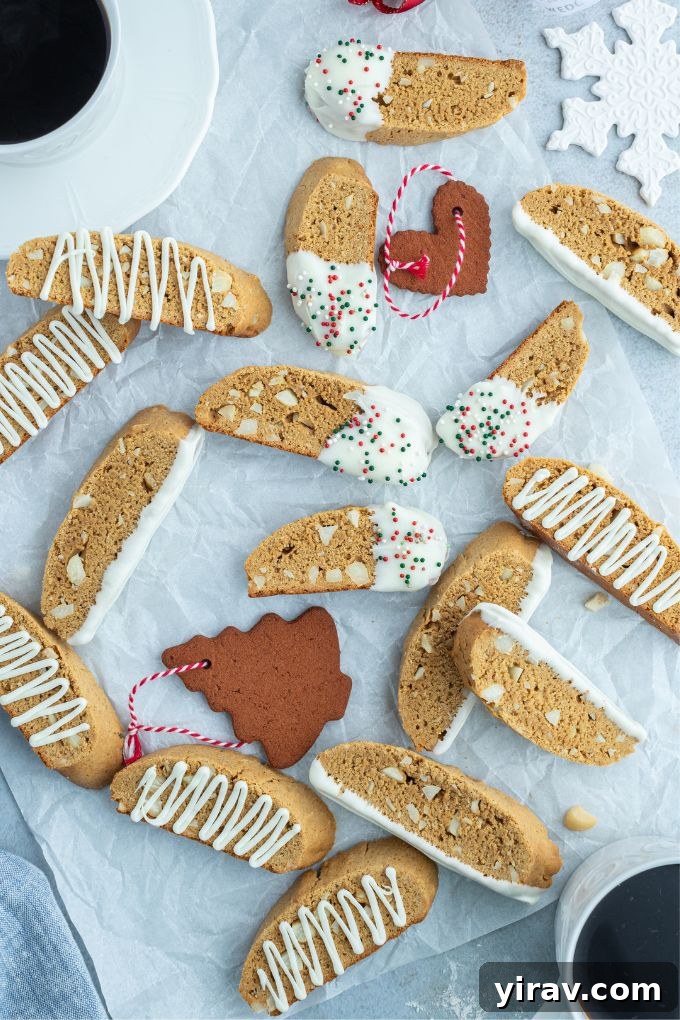 Gingerbread biscotti presented with Christmas ornaments and a cup of coffee, creating a cozy holiday scene.