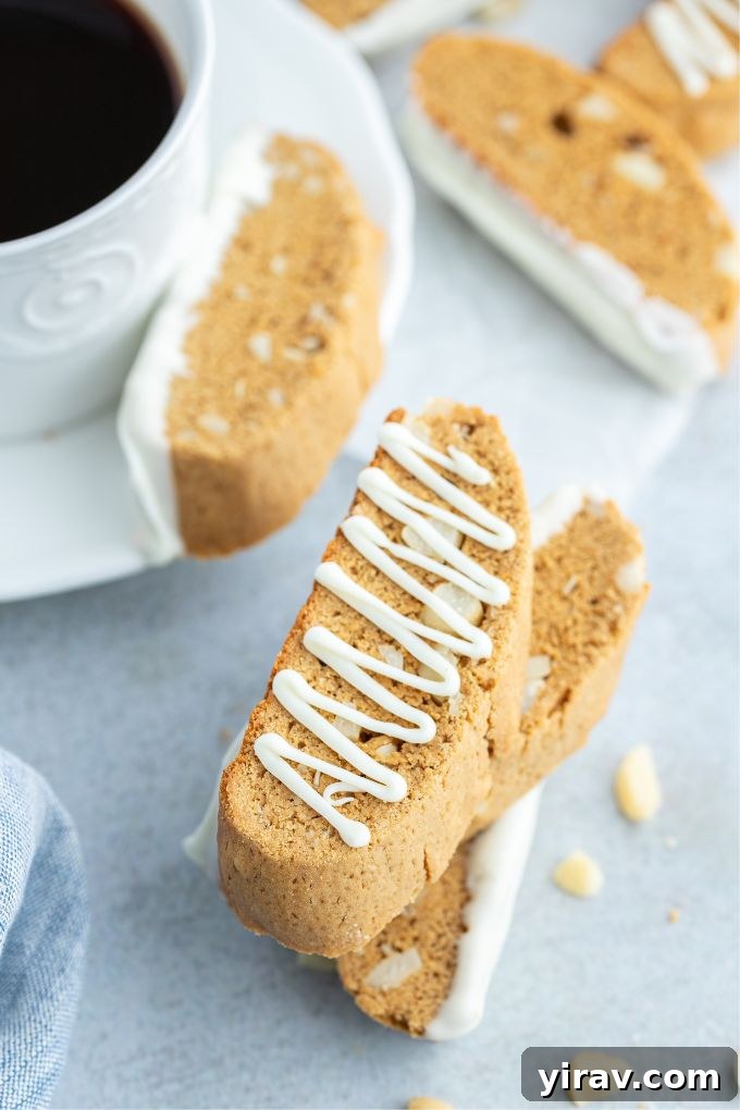 Gingerbread biscotti with white chocolate and coffee, perfect for a cozy break.