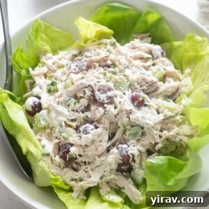 Sonoma chicken salad in a bowl over a bed of lettuce.