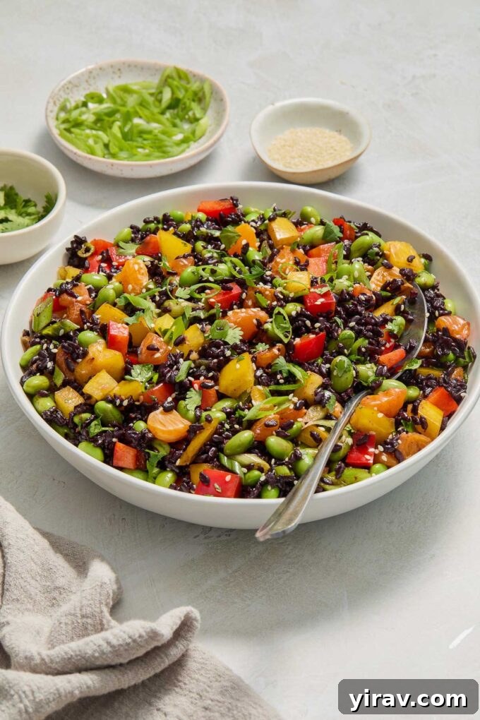 Forbidden Rice salad tossed in ginger orange dressing, ready to be served.