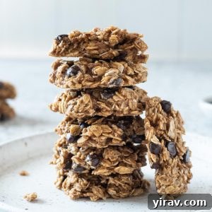 Stack of wholesome banana oatmeal breakfast cookies, ready to be eaten, showcasing their delicious appeal.