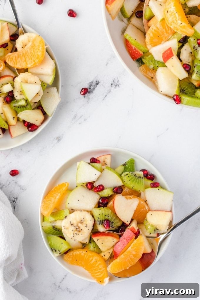 Individual servings of winter fruit salad on small white plates
