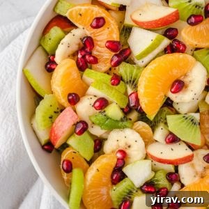 Winter fruit salad in a white bowl, ready to be served