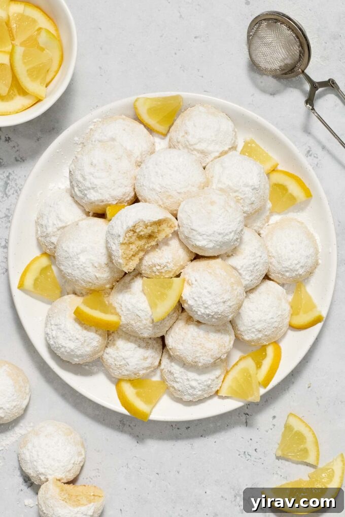 Greek butter cookies with Meyer lemon on a plate.