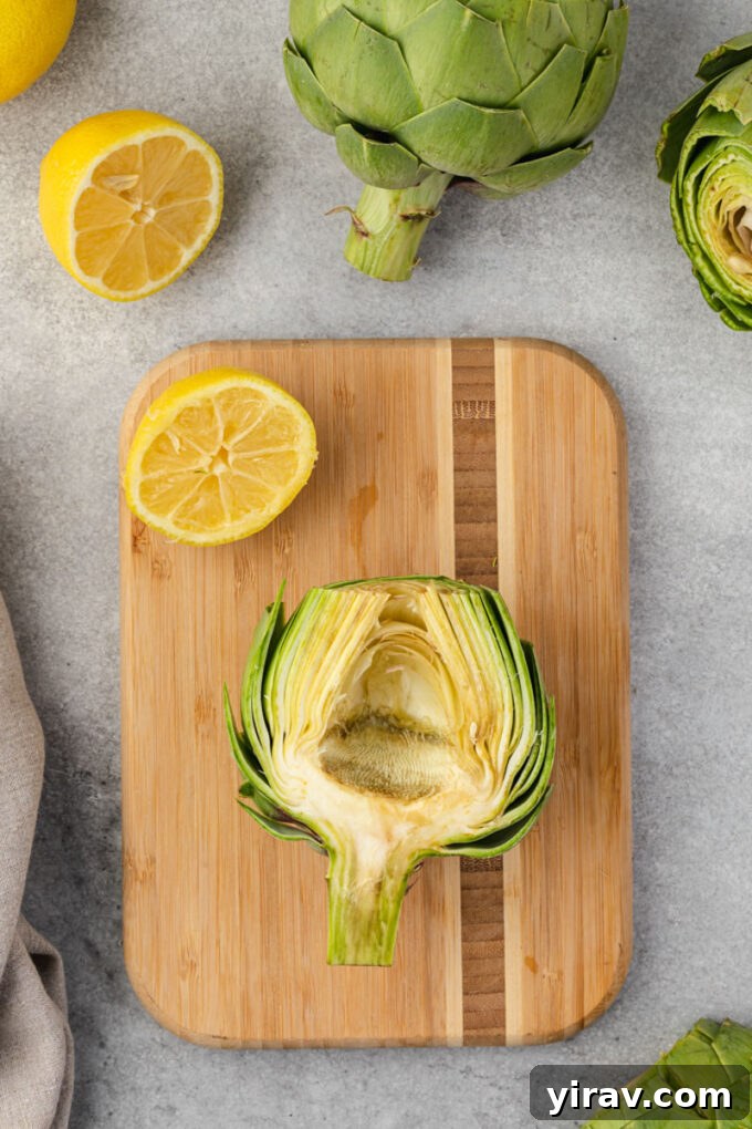 Halved artichoke with choke removed, showcasing the clean, edible artichoke heart.