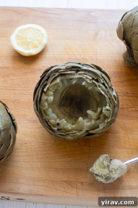 Steamed artichoke with fuzzy choke removed.