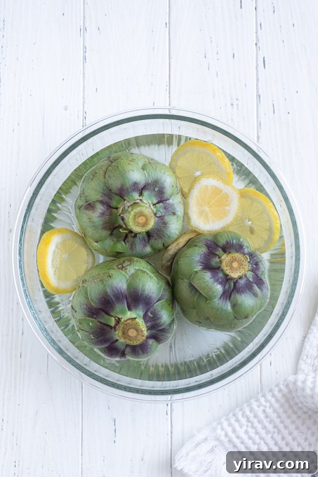 Prepped artichokes in lemon water for instant pot artichokes.