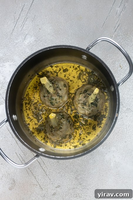 Cooked Roman artichokes in pot.