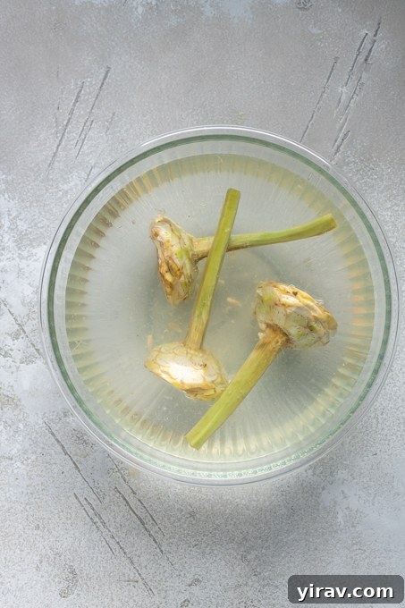 Prepped Roman artichokes in lemon water.