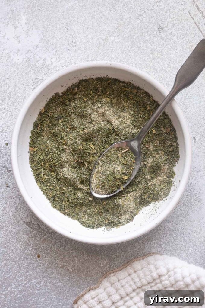 Overhead shot of ranch seasoning in bowl with spoon.