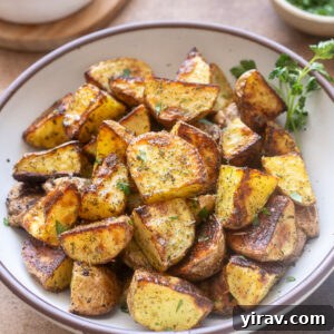 Ranch potatoes in a bowl garnished with parsley.