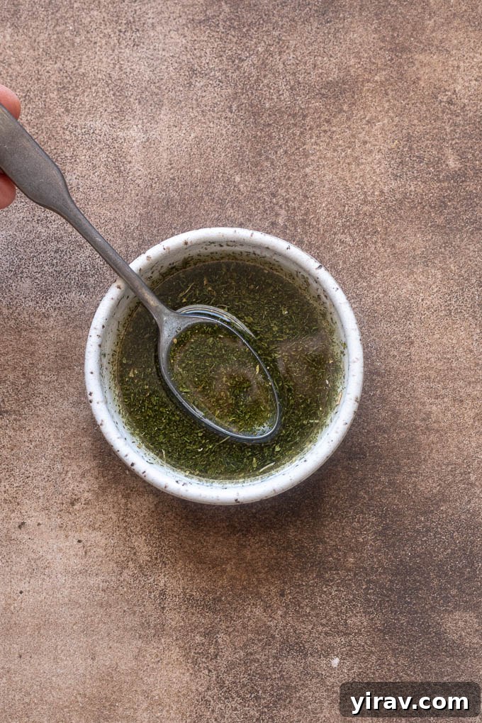 Olive oil, ranch seasoning, salt and pepper combined in a small bowl.