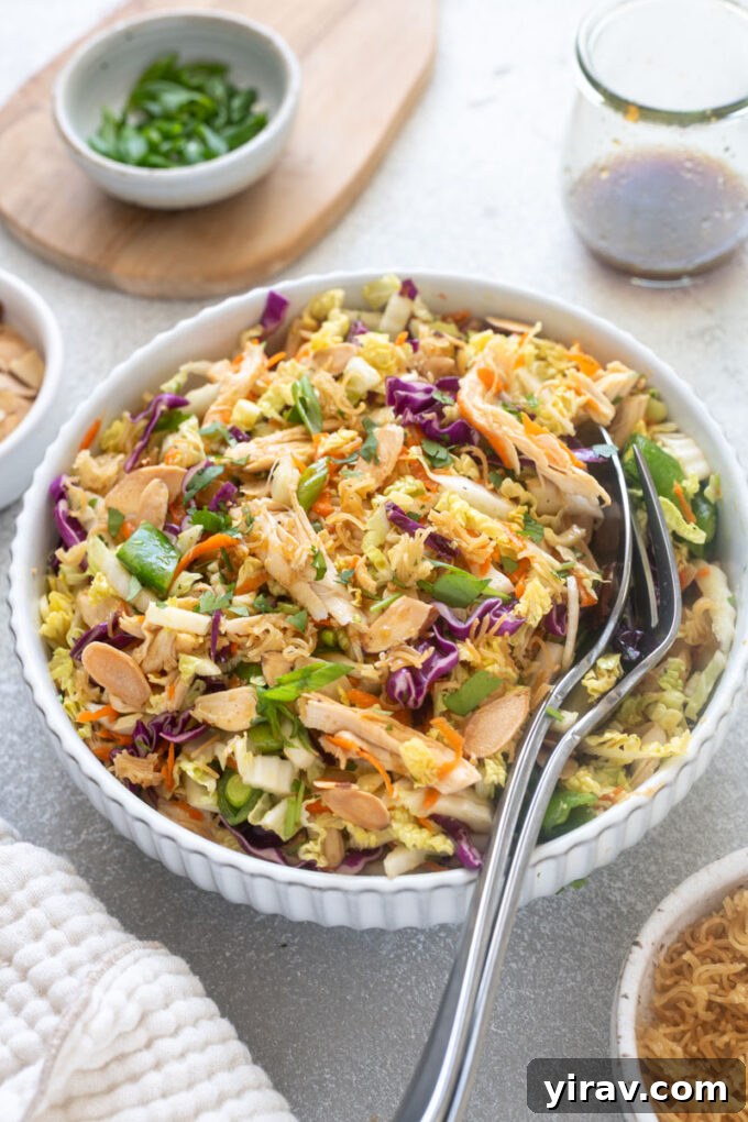 Crisp Asian Chicken Salad with Sesame Ginger Dressing 3 Chinese chicken salad with ramen noodles in a bowl.