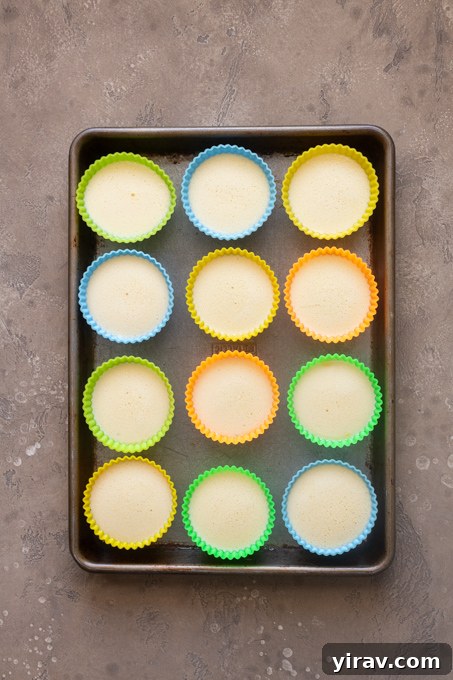 Blended egg and cottage cheese mixture in silicone muffin molds.