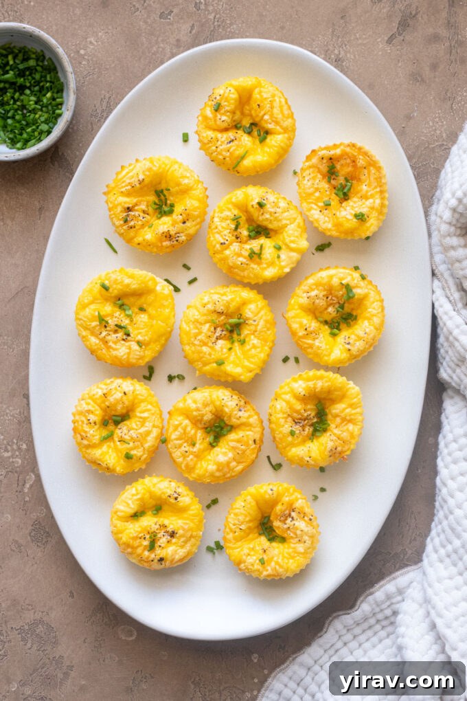 Cottage cheese egg bites on a platter topped with chives.