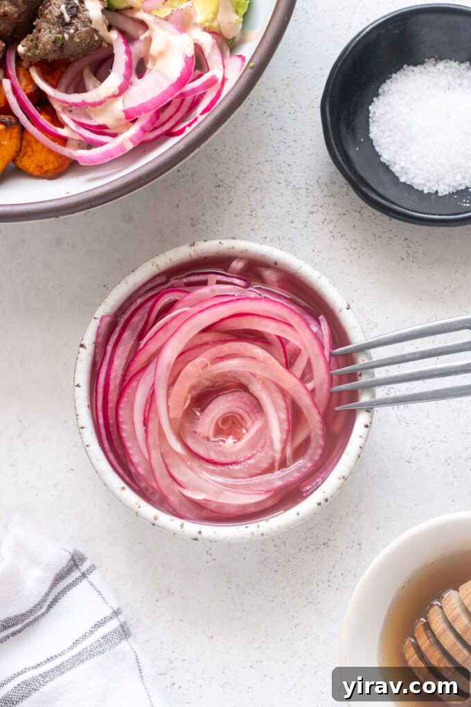 How to Make Quick Tangy Pickled Red Onions in 15 Minutes 12 Quick pickled red onions in a small bowl with fork.