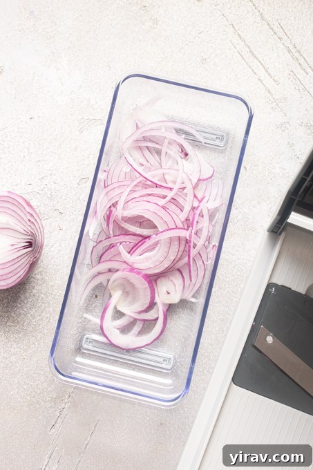 How to Make Quick Tangy Pickled Red Onions in 15 Minutes 5 Red onion sliced with a mandoline.