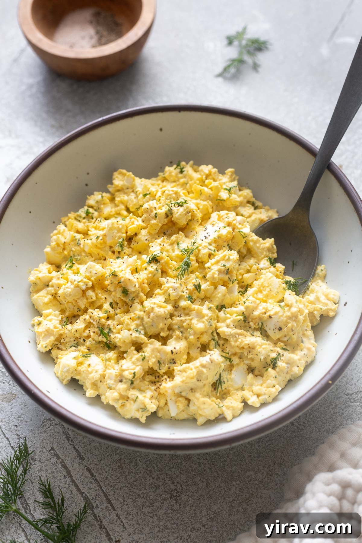 15+ Protein-Packed Salad Recipes for Meal Prep 11 Egg salad with dill in a bowl.