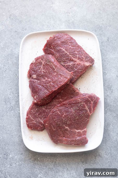 Seasoned steaks for grilled steak salad.