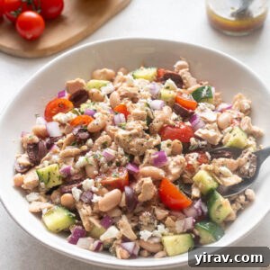 Mediterranean Tuna and White Bean Salad with Lemon Dressing 9 Tuna white bean salad in a white serving bowl.