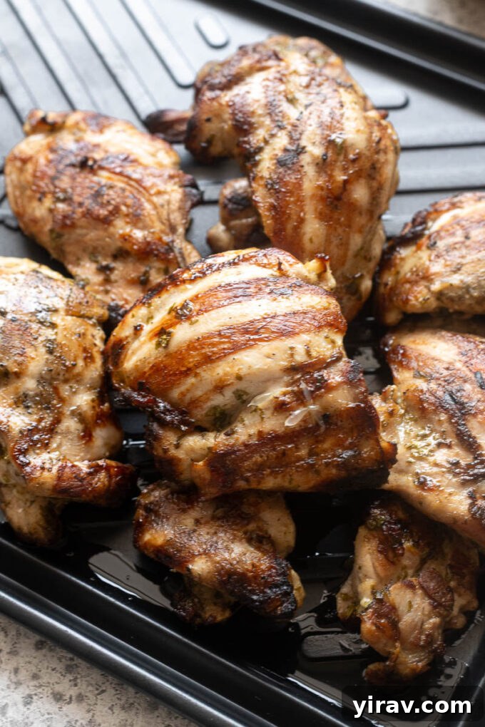 Cilantro-Lime Grilled Chicken with Zesty Marinade 8 Cilantro lime grilled chicken resting on cutting board.