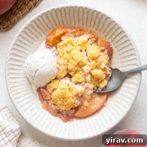 Fresh Peach Cobbler Recipe with Golden Biscuit Topping 12 Fresh peach cobbler with shortbread cookie-style topping and vanilla ice cream.