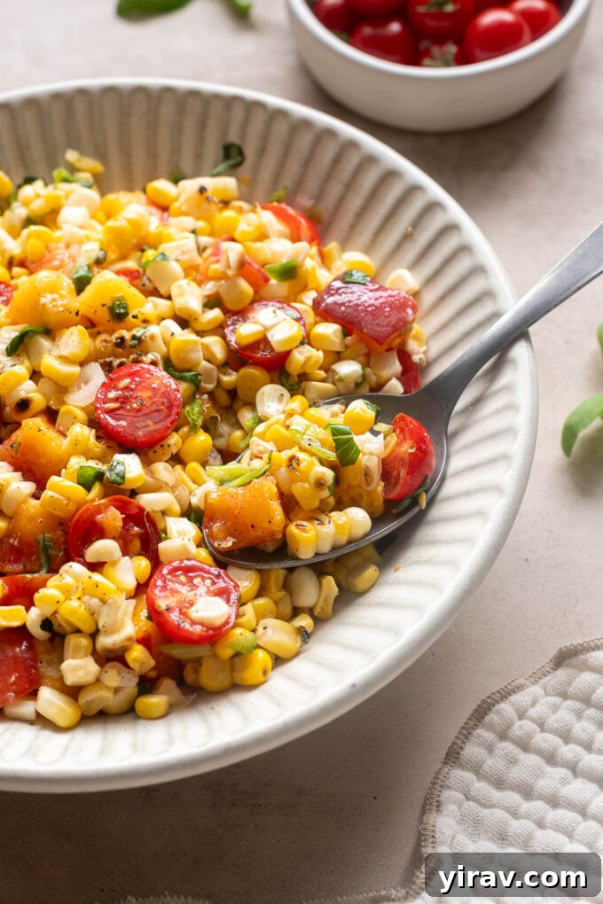 Summer Peach, Tomato and Corn Salad with Basil 10 Spoonful of peach corn salad with cherry tomatoes, grilled corn and fresh basil.