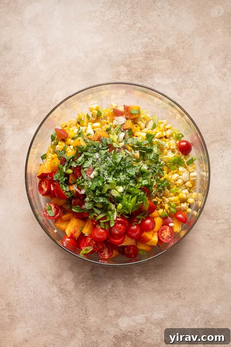 Summer Peach, Tomato and Corn Salad with Basil 7 Ingredients for peach tomato corn salad in a bowl.