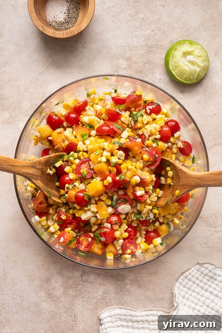 Summer Peach, Tomato and Corn Salad with Basil 8 Ingredients for peach tomato corn salad combined in a bowl.