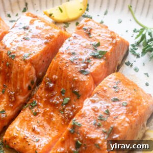Honey Garlic Glazed Salmon Recipe 10 Honey garlic salmon on a platter with parsley and lemon.