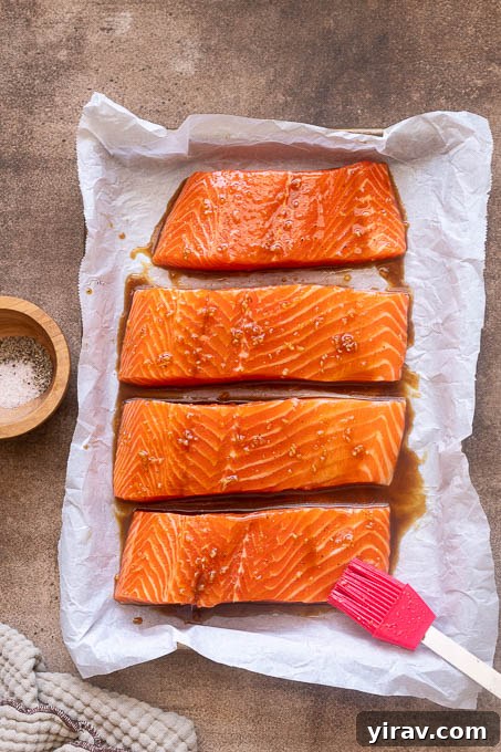 Honey Garlic Glazed Salmon Recipe 7 Salmon brushed with honey garlic sauce before baking.