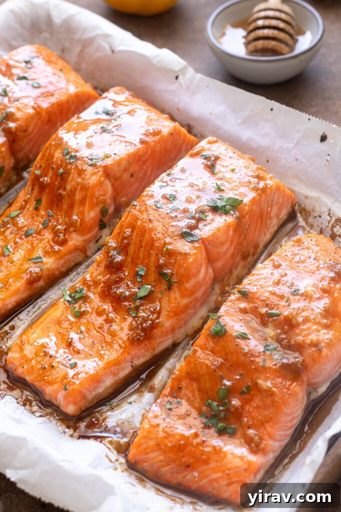 Honey Garlic Glazed Salmon Recipe 8 Honey garlic glazed salmon on baking sheet.